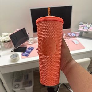 Orange Starbucks cup